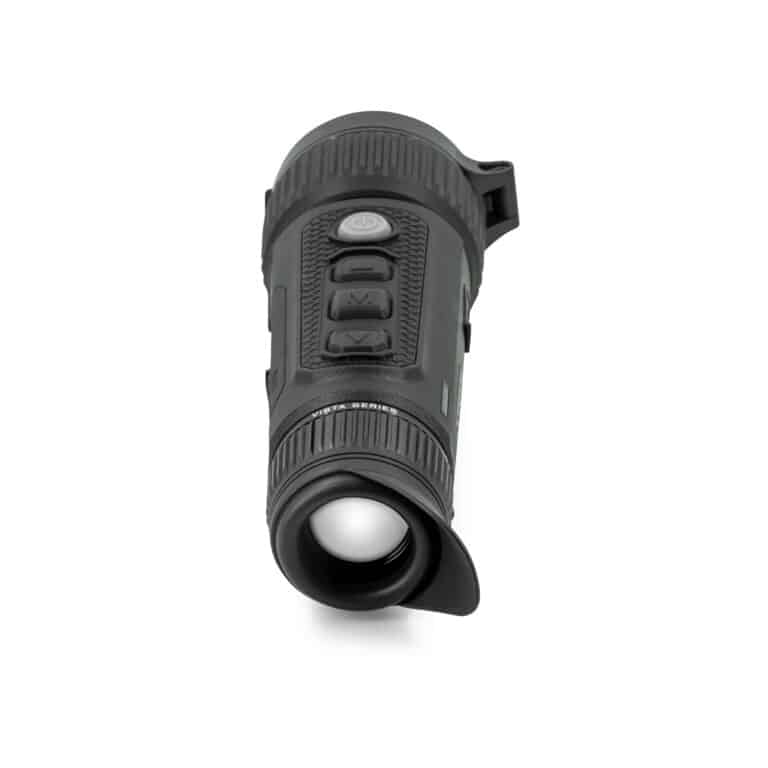 A black flashlight is on the ground.