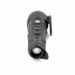 A black flashlight is on the ground.