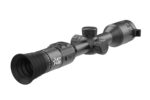 A close up of the scope on a rifle