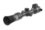 A close up of the scope on a rifle