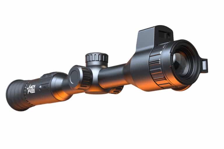 A close up of the scope on a rifle