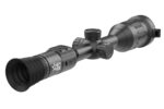 A close up of the scope on a rifle