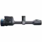 A rifle scope with an illuminated sight and a red dot.