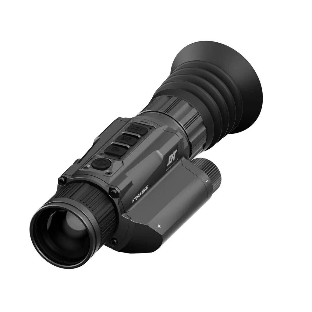 A black and gray camera with a lens attached to it.